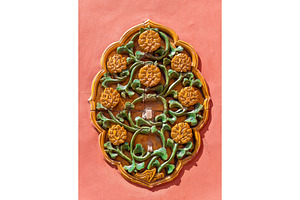 Ornate ceramic decoration on a wall of the Forbidden City, Beijing, an Architecture Photo by Leonid Andronov