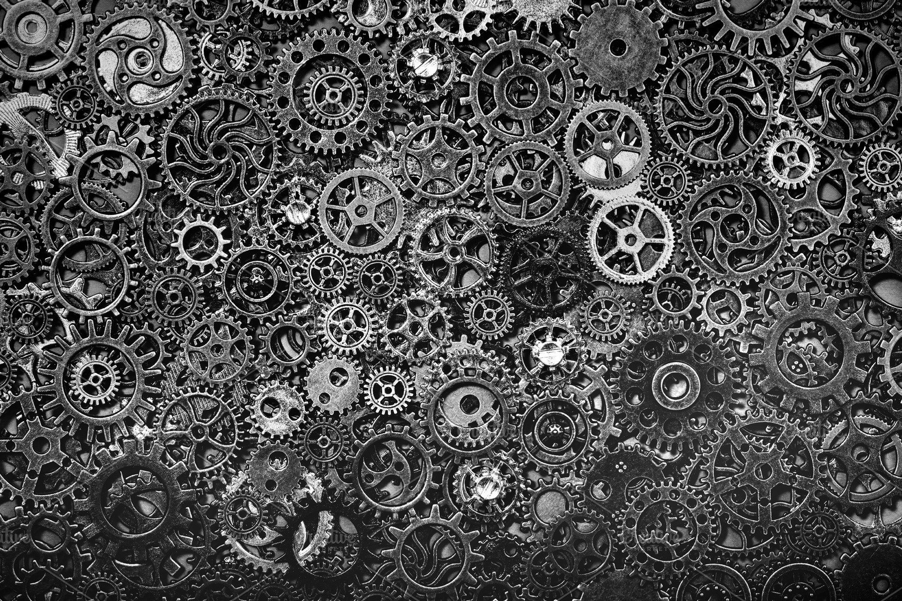 Steel cogwheels laying together tigh, an Industrial Photo by Photocreo Michal Bednarek