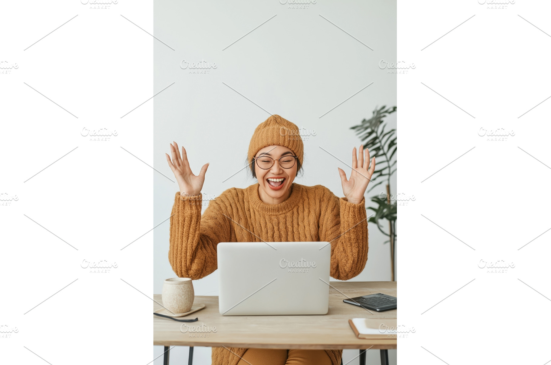 Asian woman excitedly celebrates a, a Technology Photo by Sergey Kotenev