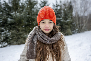 Smiling teenage girl standing, a Person Photo by HalfPoint