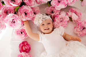 Baby girl lying on her stomach stock photo containing adorable and baby