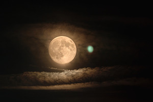 Full Moon Behind Thin Clouds in Dark