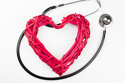 Closeup of creative composition made with big mockup heart and stethoscope on, a Health & Medical Photo by José Luis Agudo