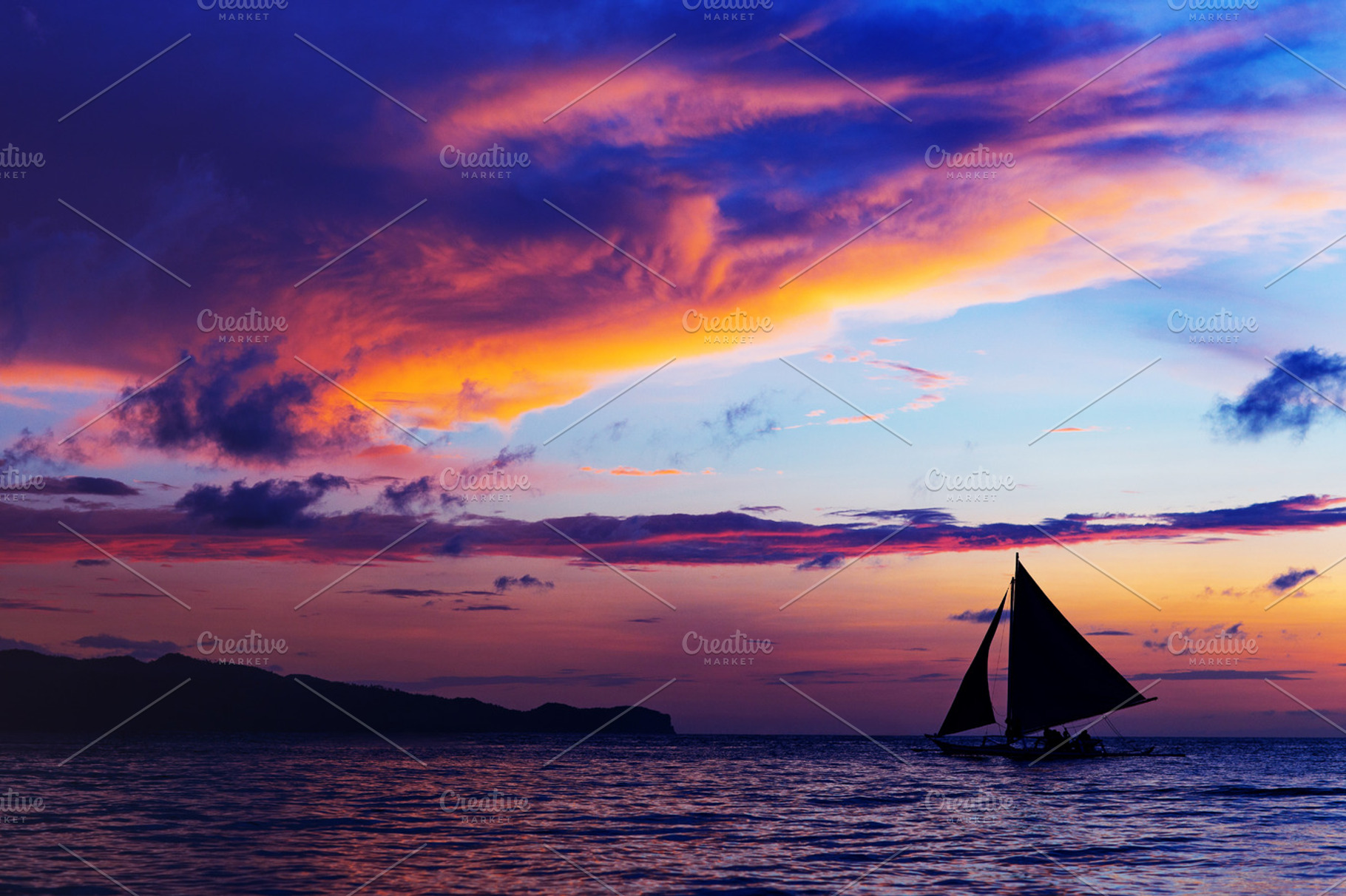 Colorful sunset at sea sailboat stock photo containing sunset and sailboat, a Person Photo by MaxFrost