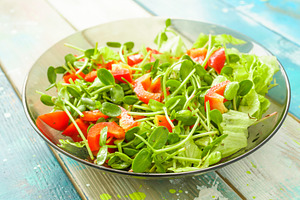 Fresh vegetable salad with micro greens and red pepper in a transparent bowl. C, a Food & Drink Photo by Eugene_Photo