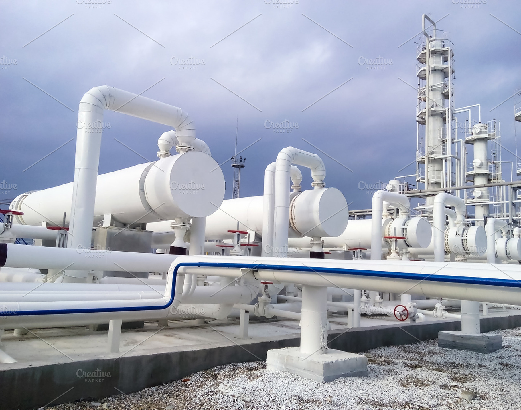Heat exchangers in a refinery stock photo containing refinery and oil, an Industrial Photo by ELEONIMAGES