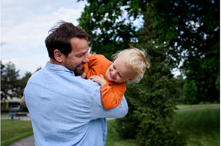 Father playing with toddler son, a Nature Photo by HalfPoint