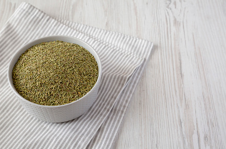 Organic Dried Rosemary in a Bowl, low angle view. Copy space., a Food & Drink Photo by LiudmylaChuhunova
