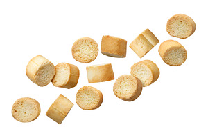 Round croutons fly close up on a