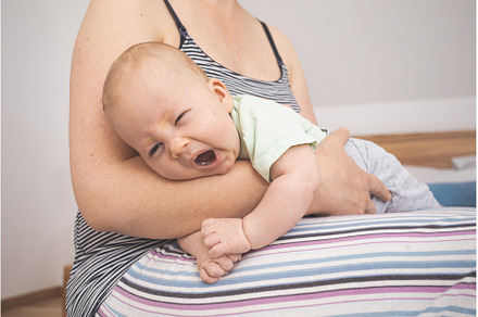 Mother holding and rocking baby, a Person Photo by oksix