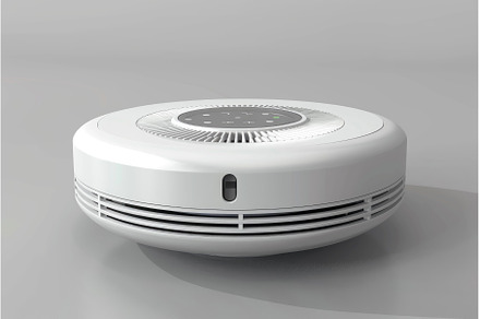 Modern smoke detector resting on, a Technology Photo by Ylivdesign