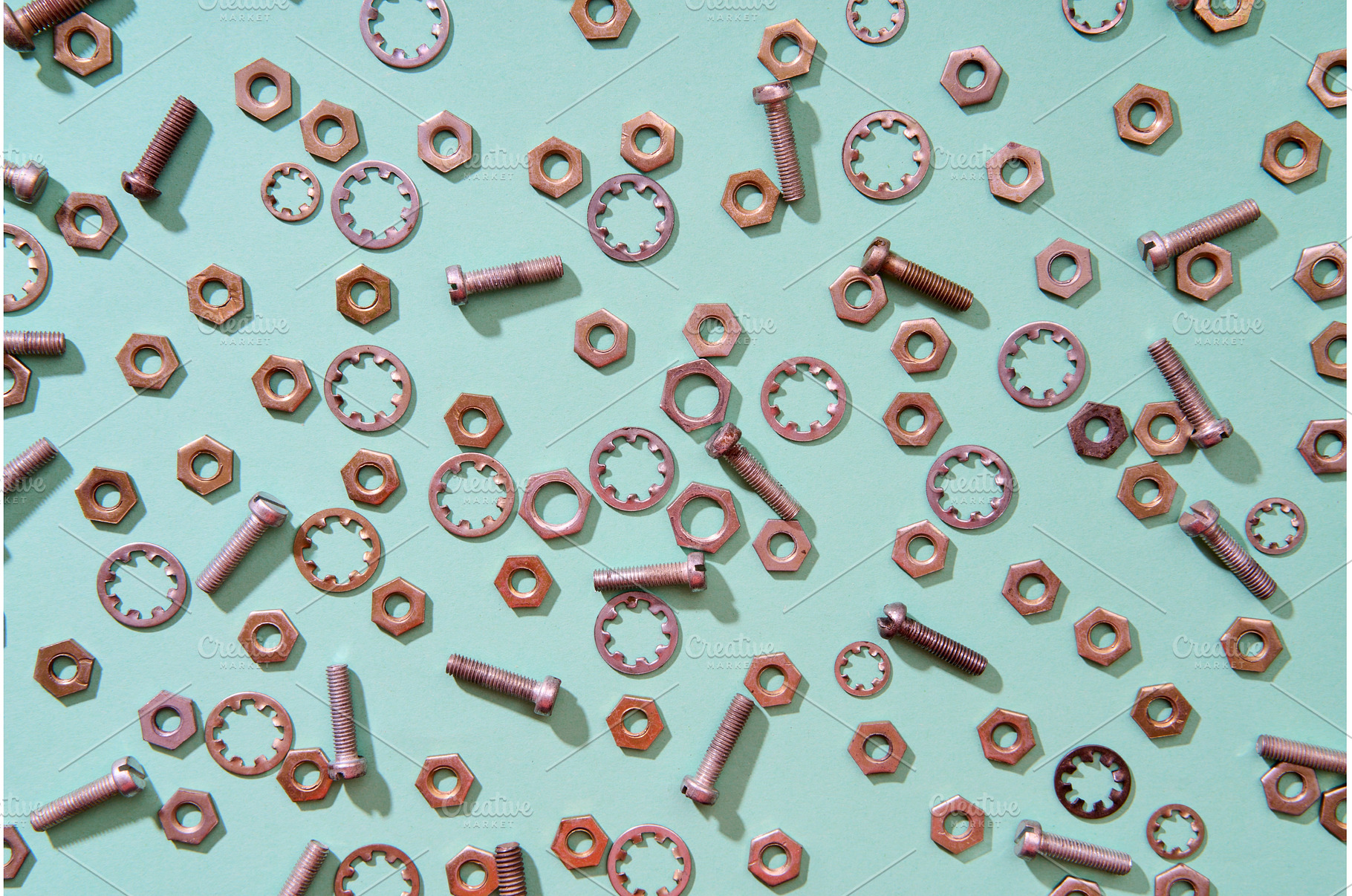 Scattered metal nuts bolts and, an Industrial Photo by Gladkov photography