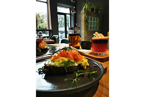 Croissant with salmon, cold coffee, a Food & Drink Photo by sceptical cactus