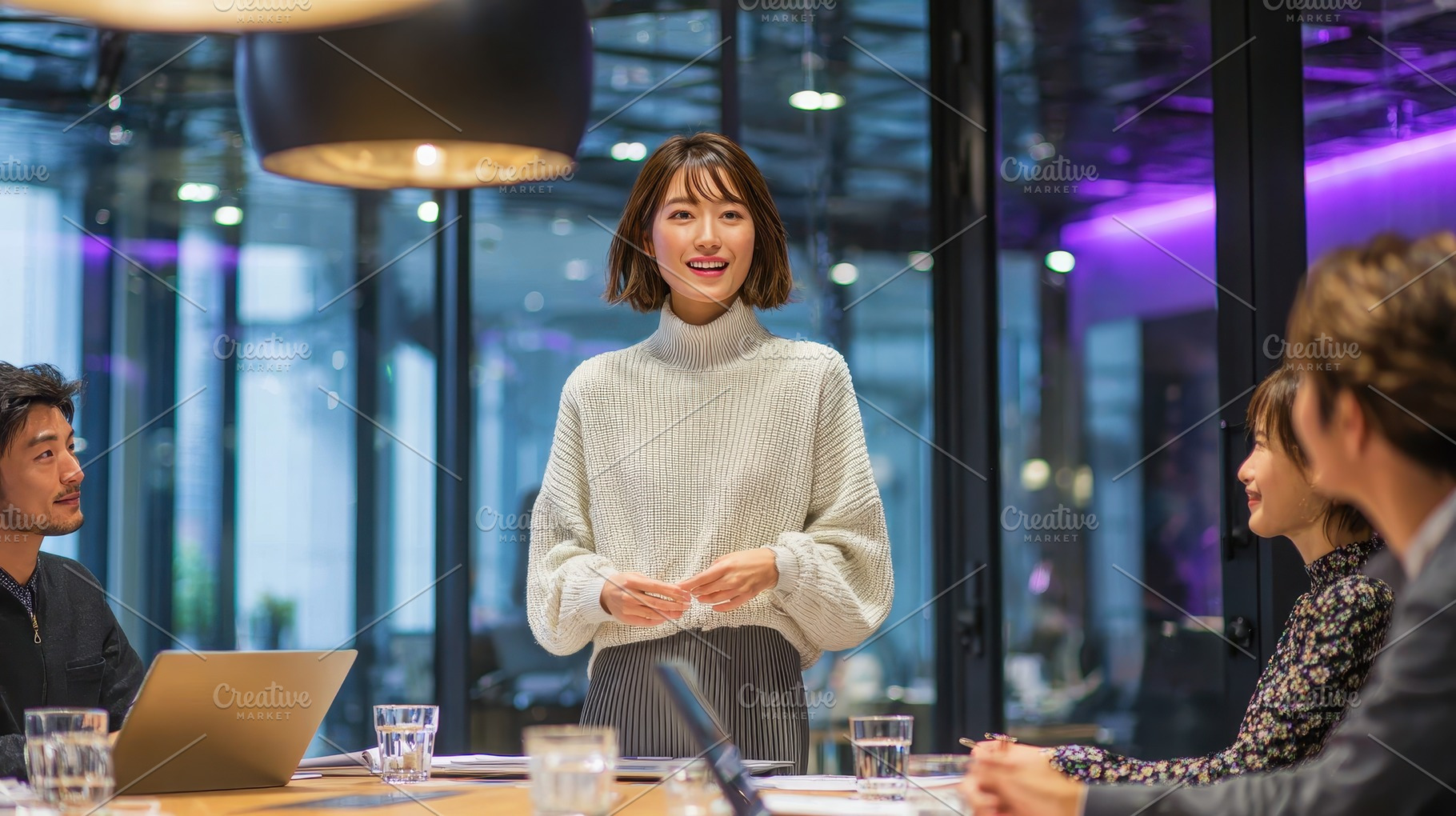 Young woman presenting to colleagues, a Photo by Pixeness Studio