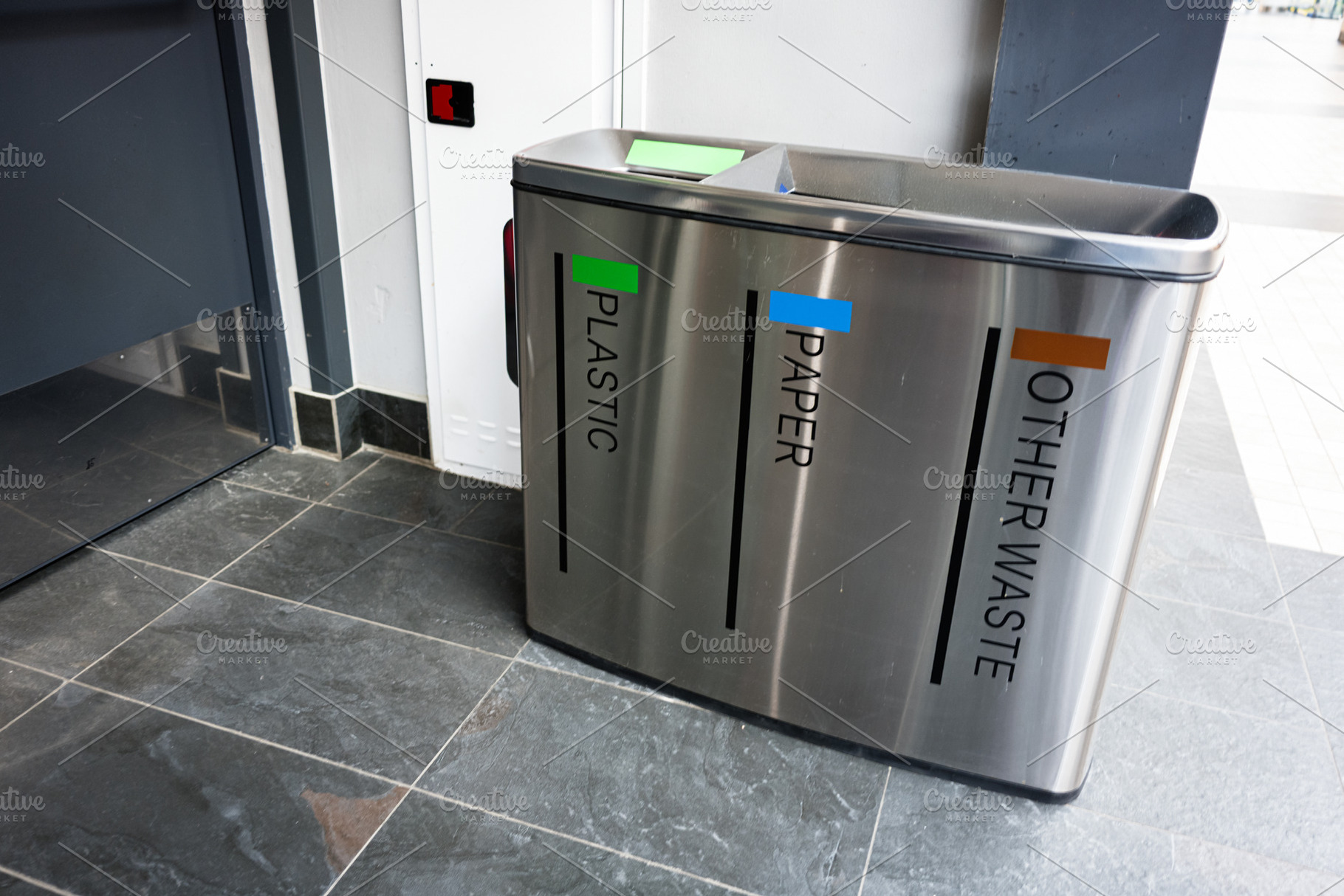 Modern recycling bins for plastic, paper, and waste in public location, a Photo by AS photostudio