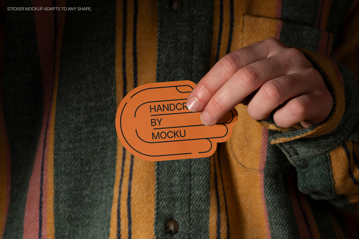 Sticker in Hand Mockups, a Packaging Mockup by Mocku