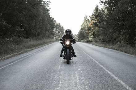 Young woman driving motorcycle featuring motorcycle, woman, and bike, a Transportation Photo by Aliaksei Kaponia