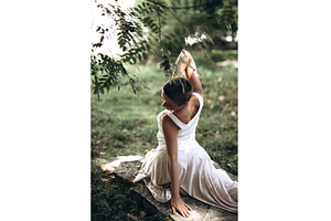 Woman meditating outdoor in nature, a Beauty & Fashion Photo by Anna Efetova