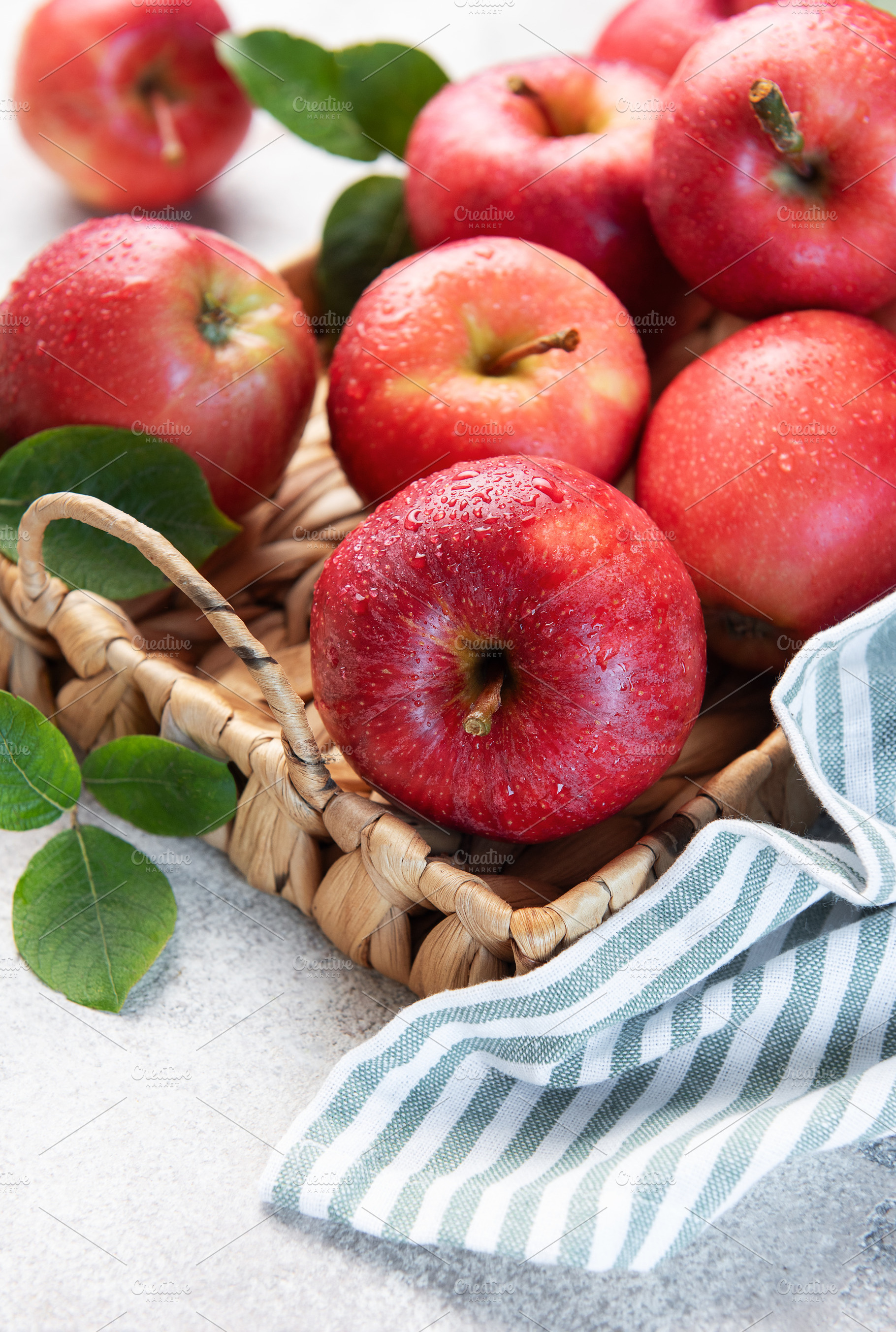 Fresh red apples resting in a basket, a symbol of healthy eating, a Food & Drink Photo by Olena Rudo
