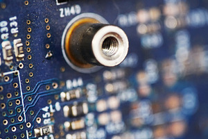 Macro shot of a quartz crystal oscillator on a blue circuit board., a Technology Photo by Rohan Photography