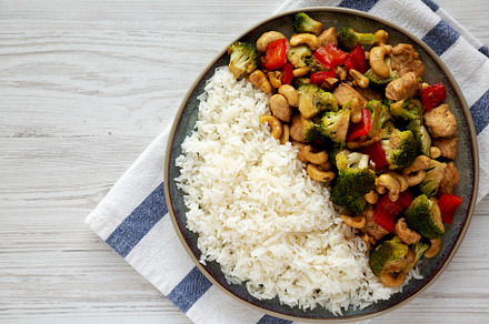 Homemade Cashew Chicken Stir-Fry on a Plate, top view. Copy spac, a Food & Drink Photo by LiudmylaChuhunova