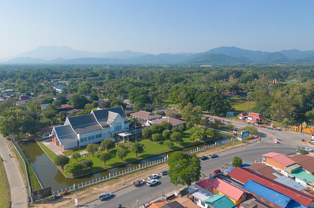 Aerial view of local residential neighborhood roofs. Urban housi