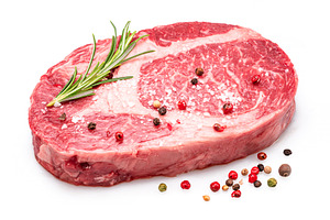 Raw ribeye steak with pepper corns, a Food & Drink Photo by Volff