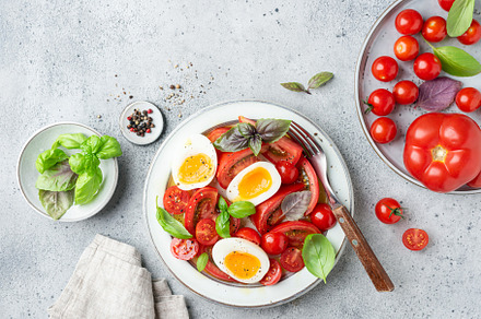 Summer salad with tomatoes and eggs, a Food & Drink Photo by The baking man