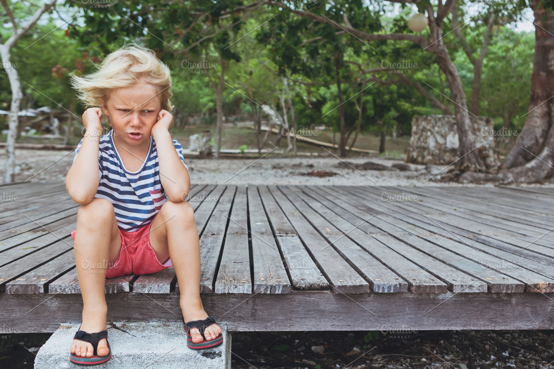Angry boy stock photo containing unhappy and sad, a Person Photo by Tropical Studio