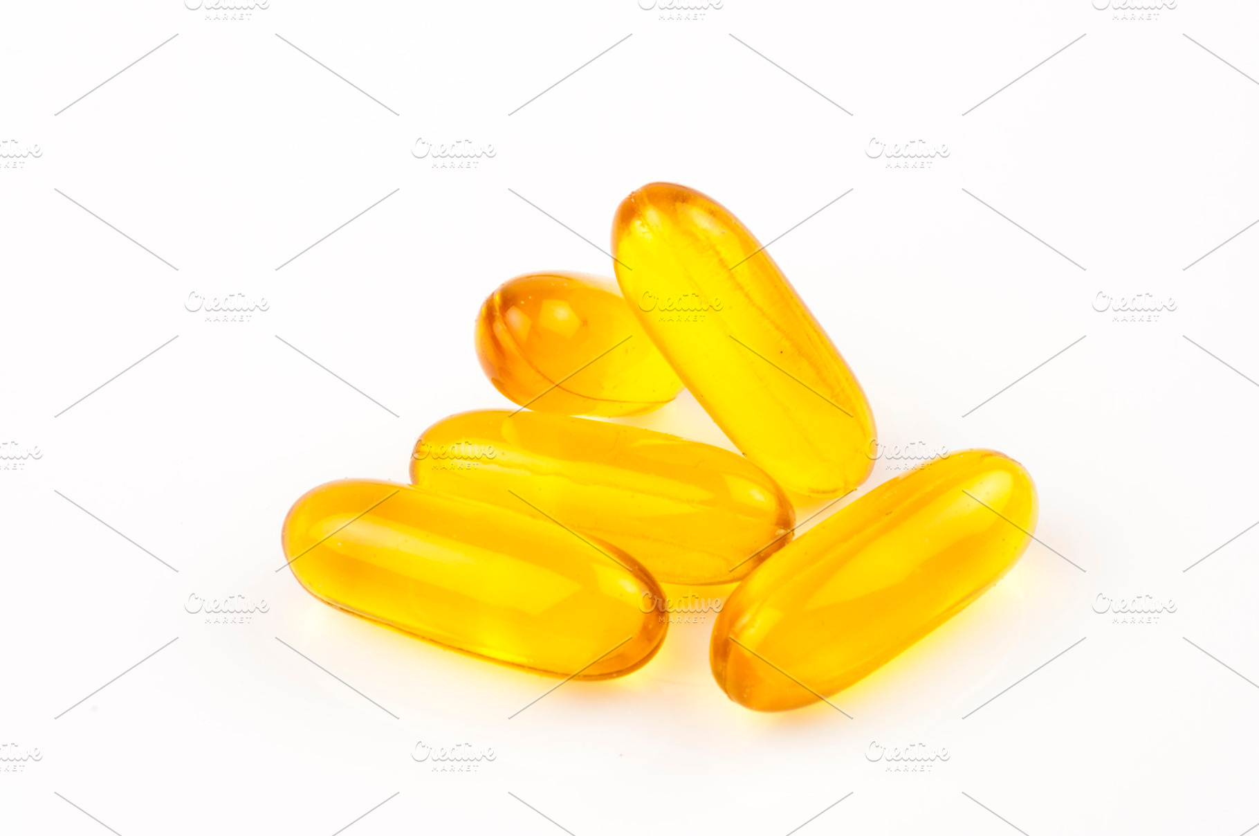 Yellow capsules on white, a Health & Medical Photo by Sainath Chillapuram