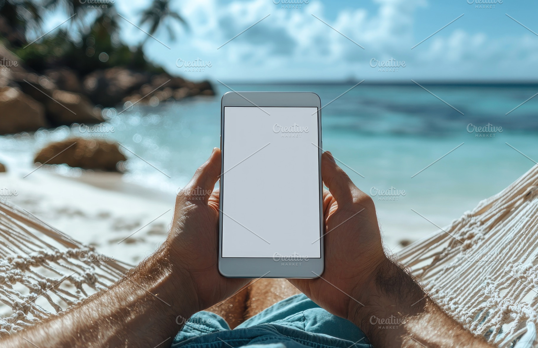 Person holding smartphone with blank white screen while relaxing, a Person Photo by José Manuel Gelpi
