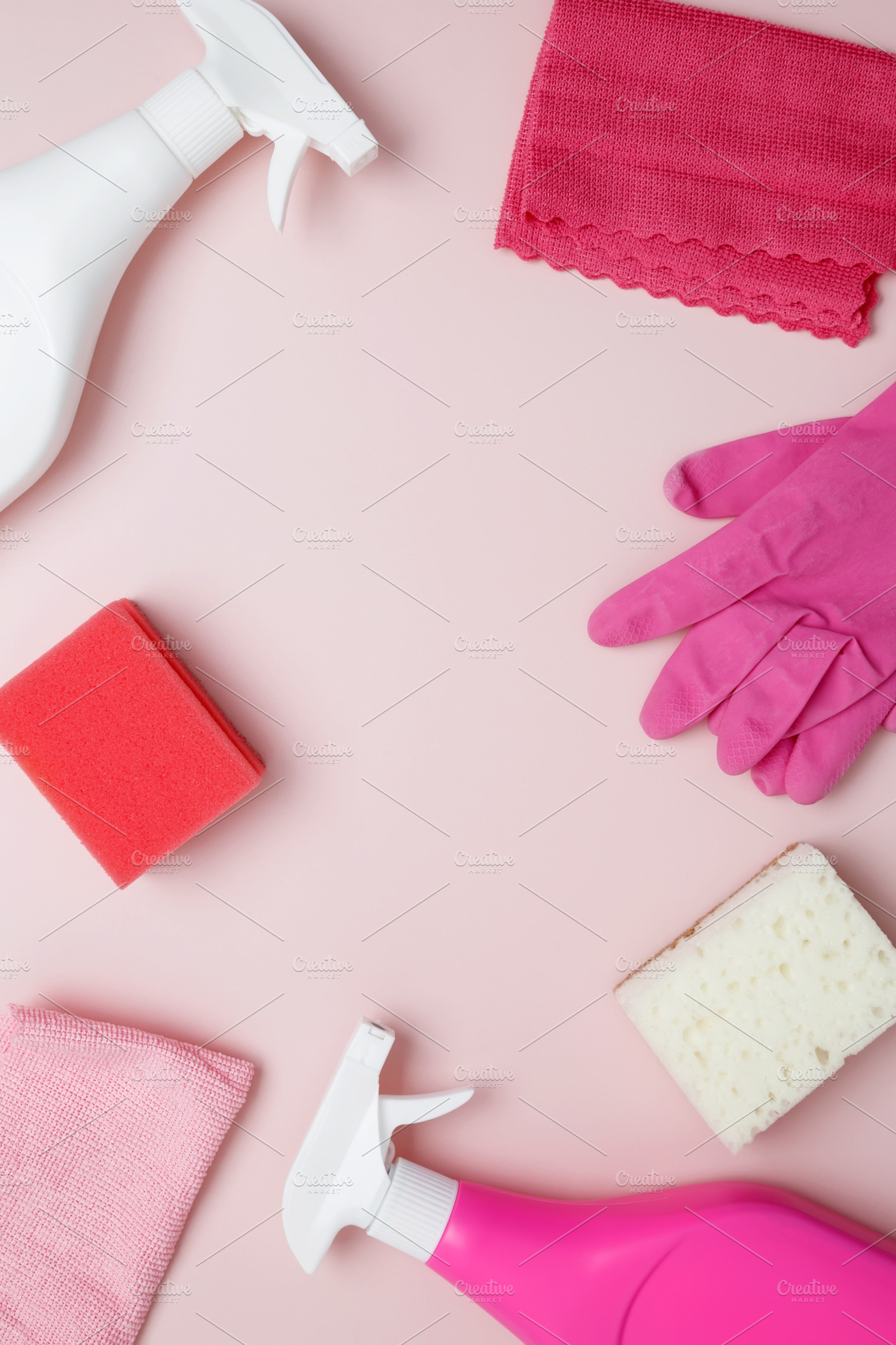 Household cleaning and hygiene concept. Pink cleaning supplies including rubber, a Photo by matucha