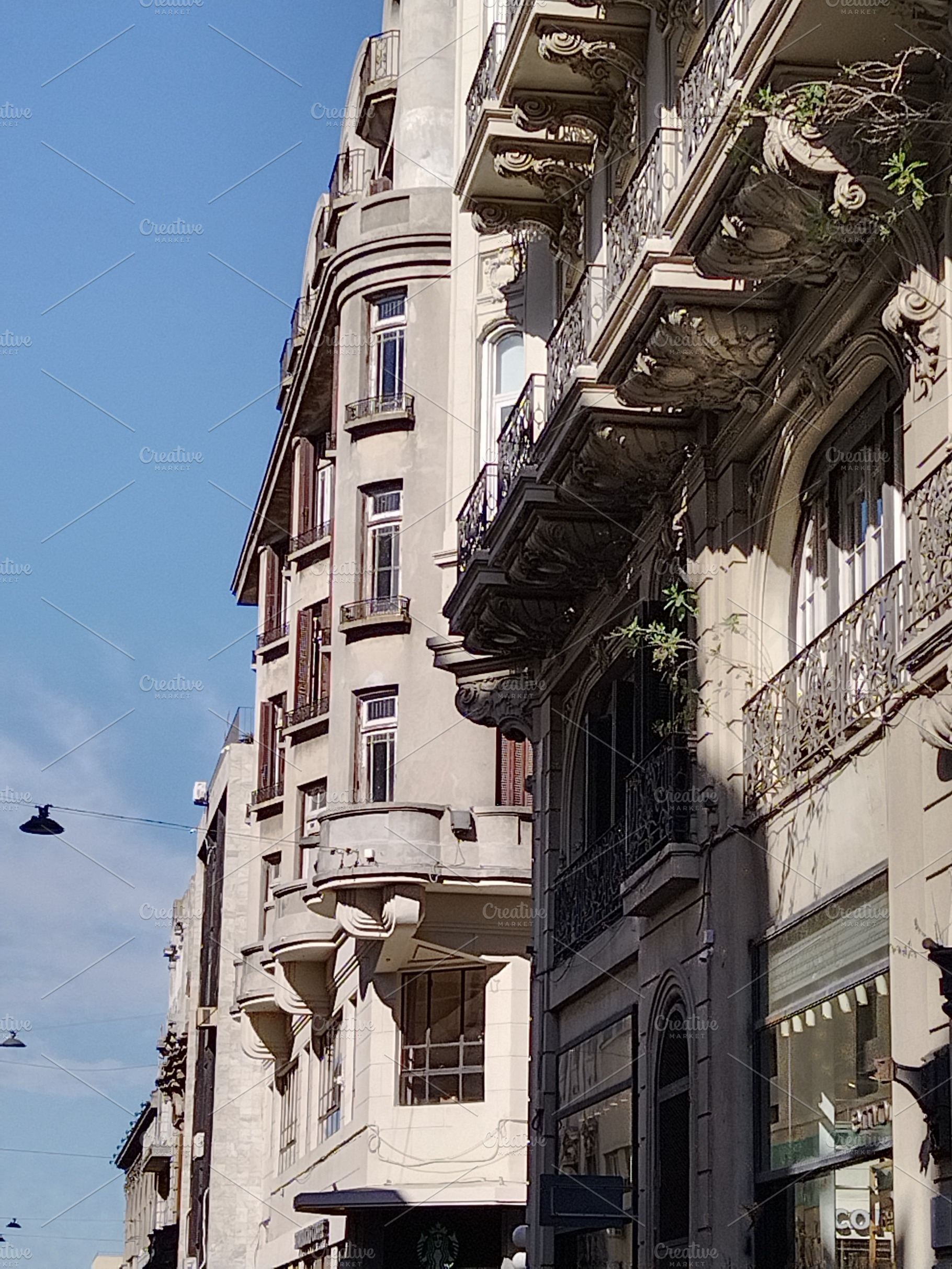 Historic city corner with ornate balconies, an Architecture Photo by DanFLCreativo
