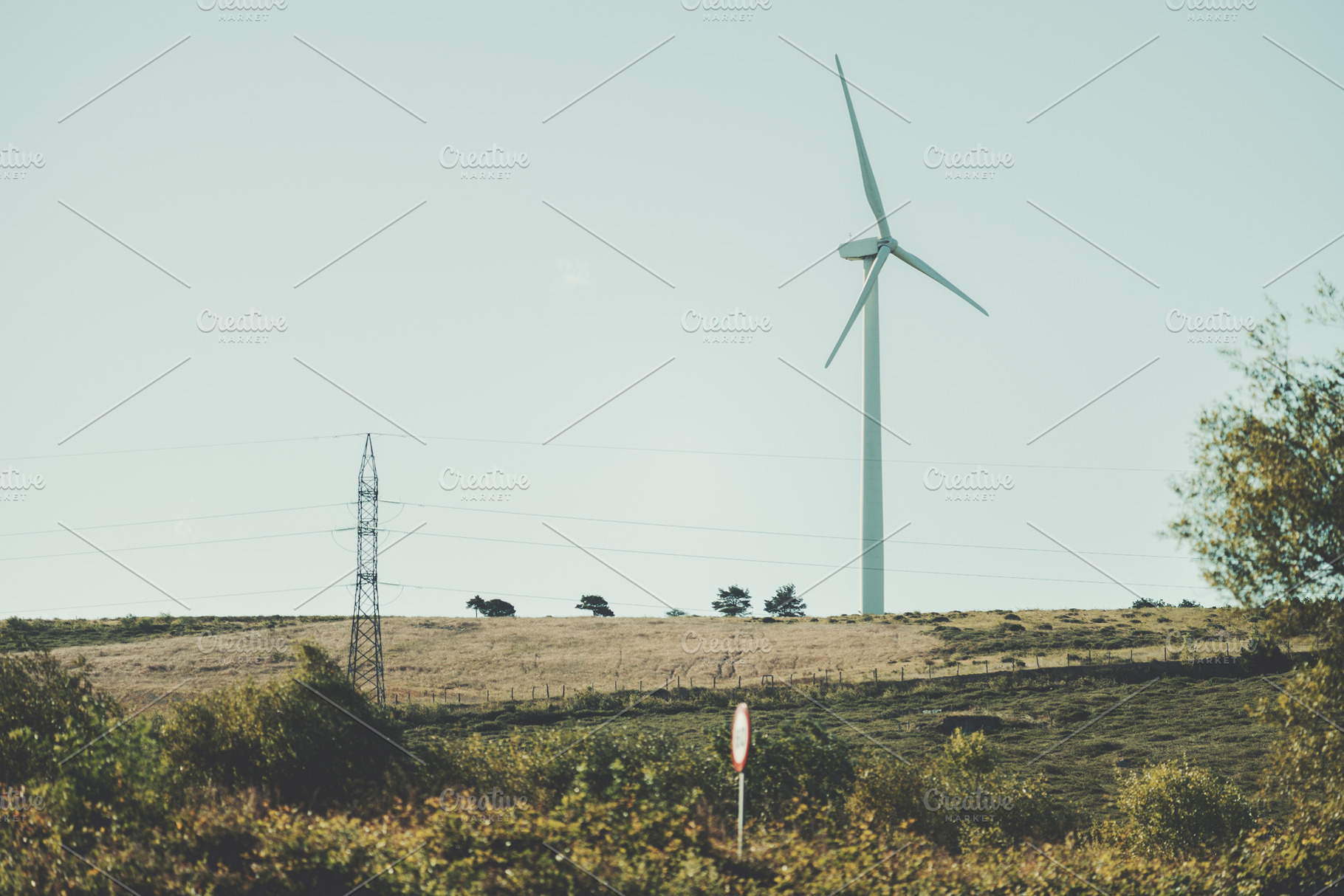 Wind turbine in rural landscape, a Technology Photo by SkyNext