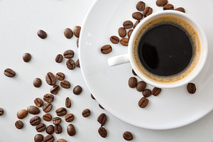 Coffee cup in white ceramic mug on white table, a Food & Drink Photo by Davizro's Market