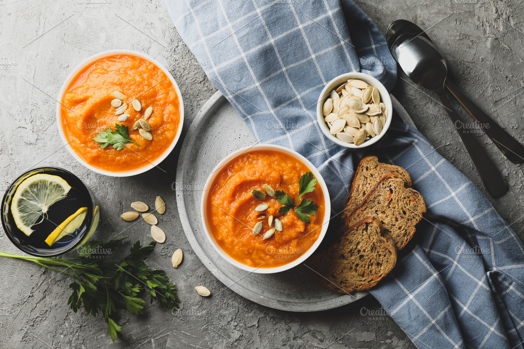 Composition with pumpkin soup on gray background, top view, a Food & Drink Photo by AtlasStudio PRO