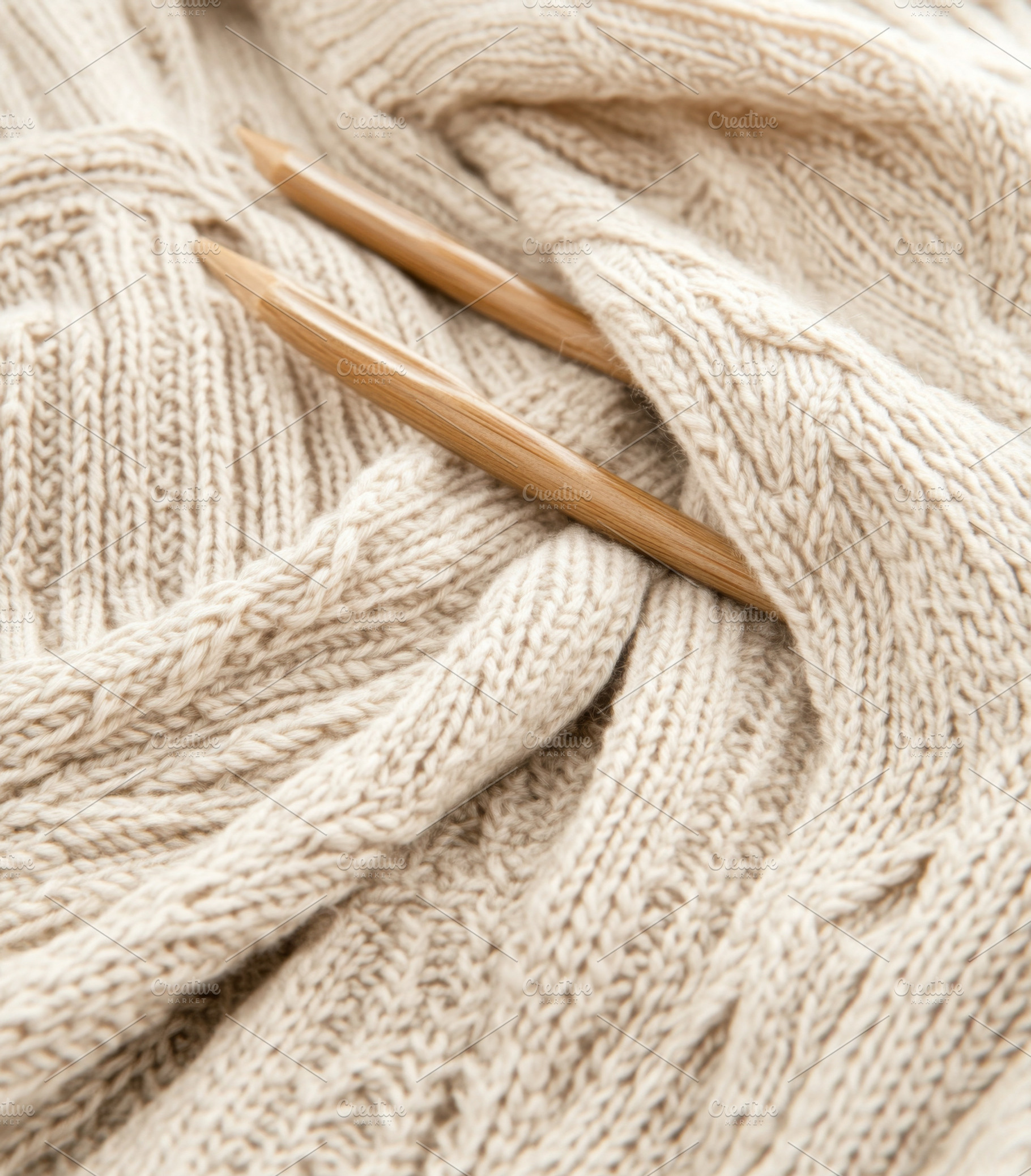 Knitting needles with yarn creating, a Photo by Dvoevnore photos