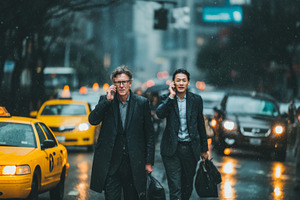 Business professionals commuting through rainy city street during busy morning, a Person Photo by AS photostudio