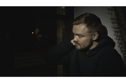 Young man sits tired and looks out, a Person Photo by Media Whale Stock
