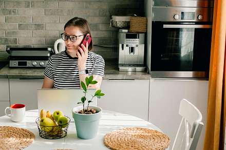 Freelancer smiling woman using smart phone. Lifestyle, social media, small busi, a Person Photo by Anikona