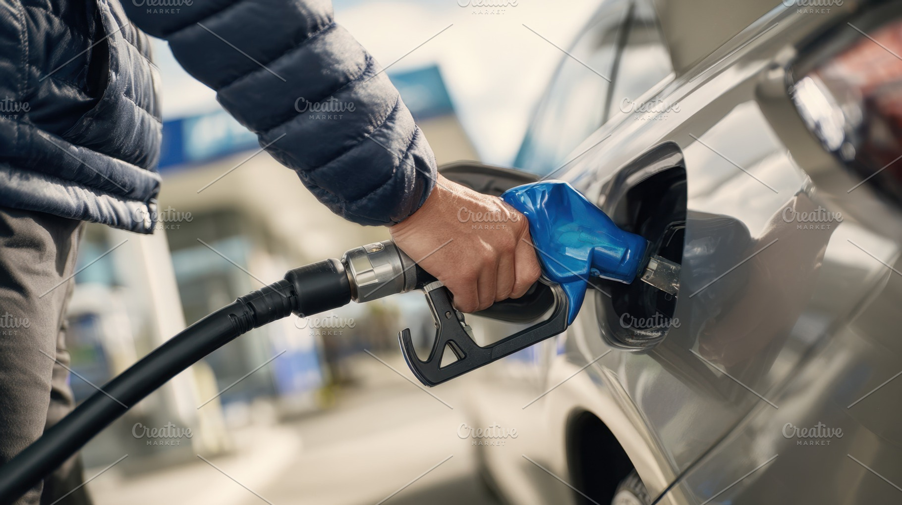Filling up gas at a station, a Photo by Beautiful things