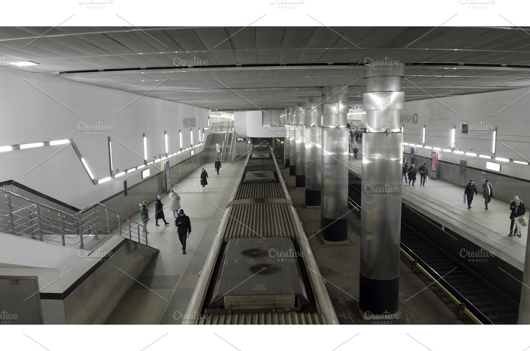 Subway train arriving at platform, a Transportation Photo by Media Whale Stock