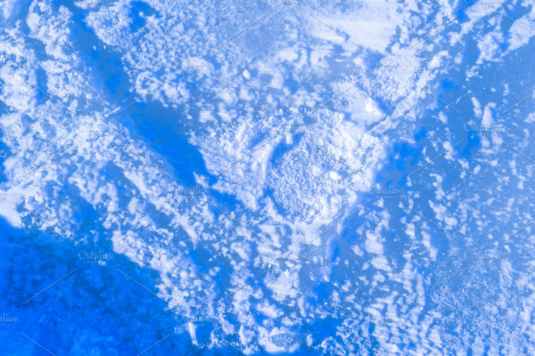 Blue rough ice texture with snow, winter background, a Photo by MDBildes