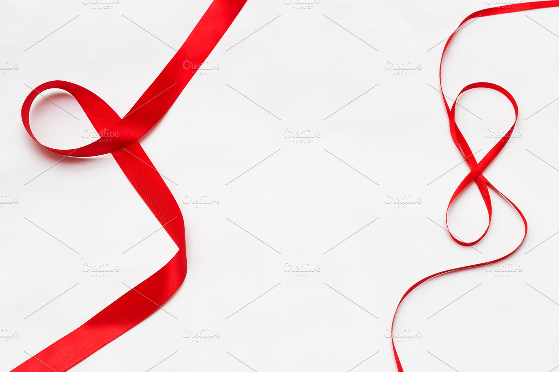 Red tape on a white background., a Holiday Photo by Mockups4you