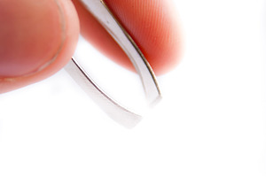 Holding Tweezers Isolated, a Beauty & Fashion Photo by THP Creative