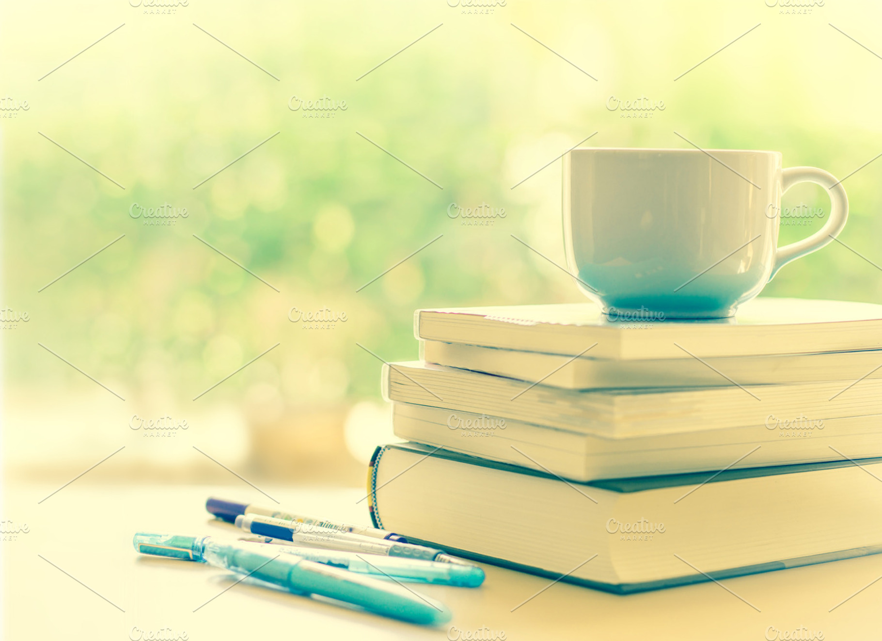 White coffee cup and  books stacking, an Arts & Entertainment Photo by Cozine