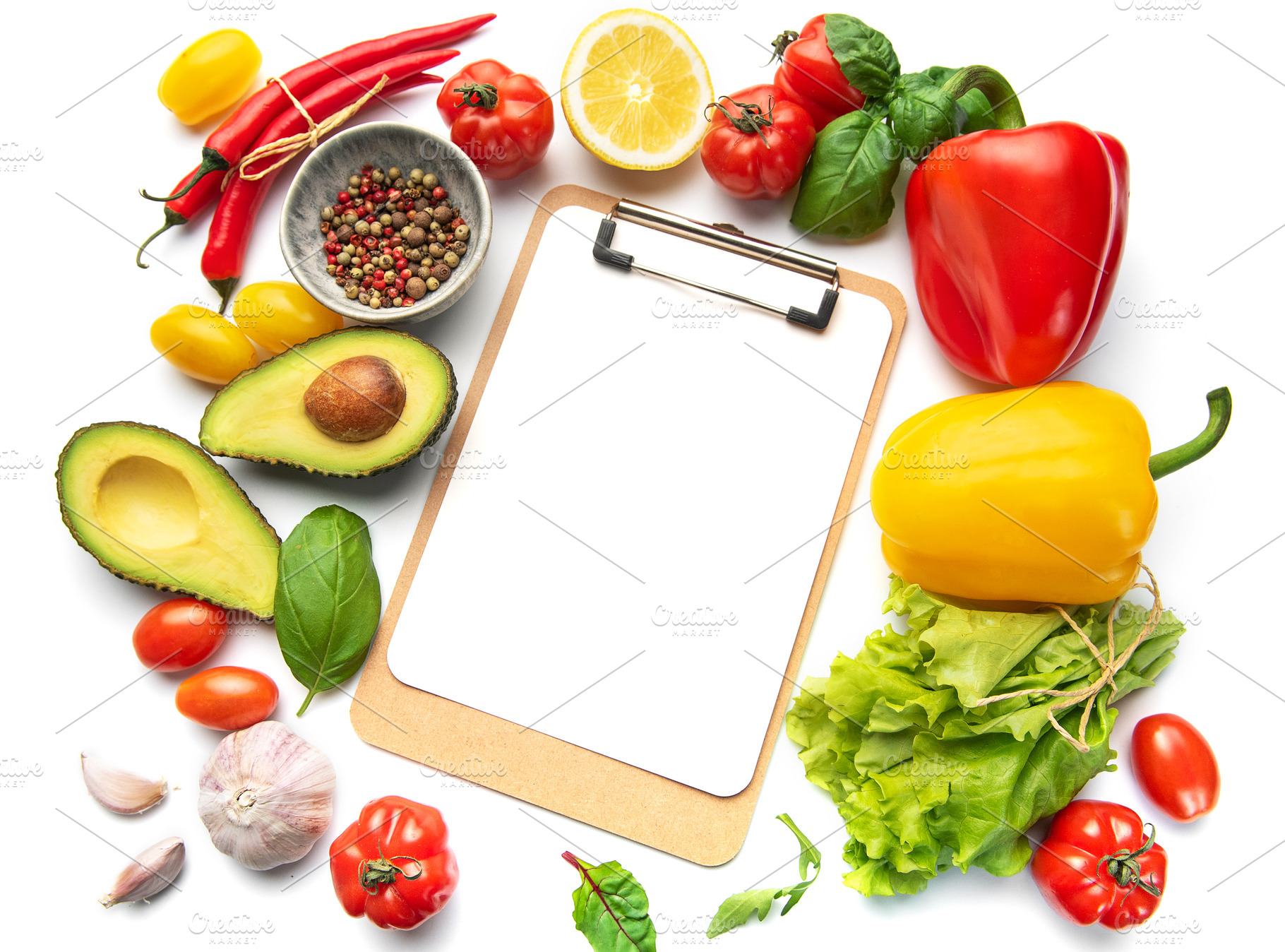 Fresh vegetables and clipboard for healthy meal planning, a Food & Drink Photo by Olena Rudo