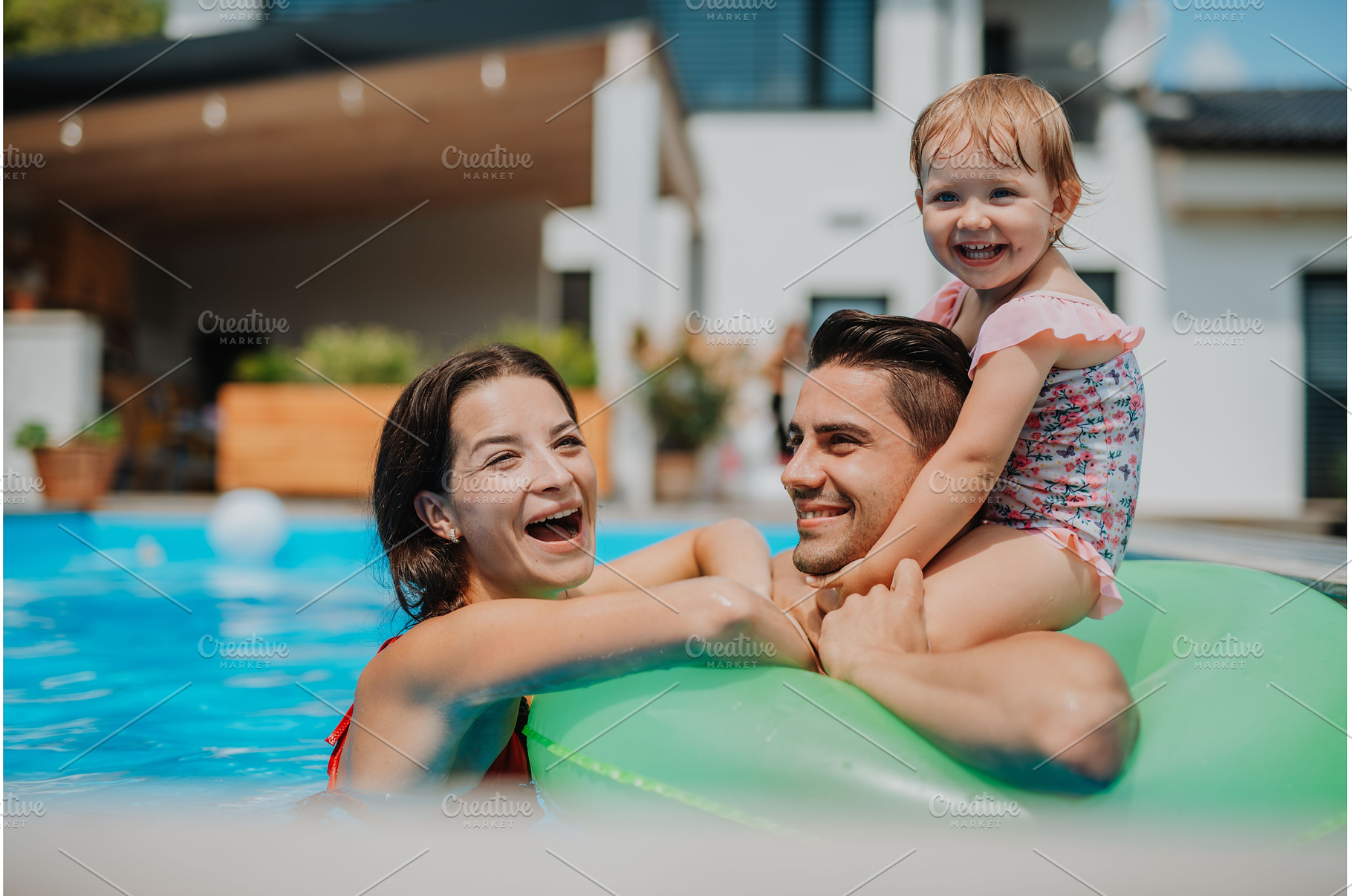 Parents and child having fun with, a Person Photo by HalfPoint