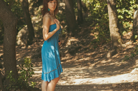 Young girl in the shadows on a path, a Person Photo by photoWorkshop