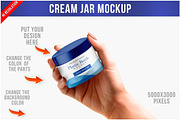 Hand Holding a Cream Jar Mockup PSD, a Packaging Mockup by Bruno's Shop (Thumbnail 1 of 4)